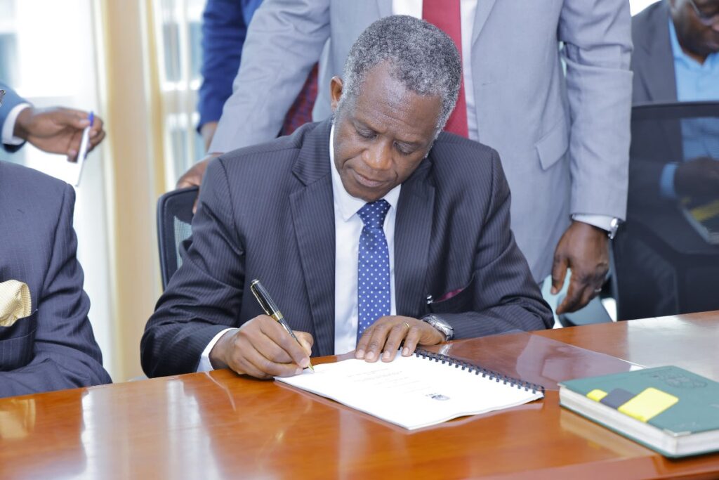 Photograph of the Chairman UWA Board of Trustees, Prof. James Kalema taken during the signing of the 25-year concession agreement for the development and operation of a luxury lodge at Channel Track near the renowned Kazinga Channel in Queen Elizabeth National Park