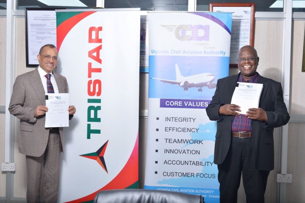 Photograph of the Director General of UCAA, Mr. Fred Bamwesigye posing with the Group Chief Executive of Tristar, Mr. Eugene Mayne