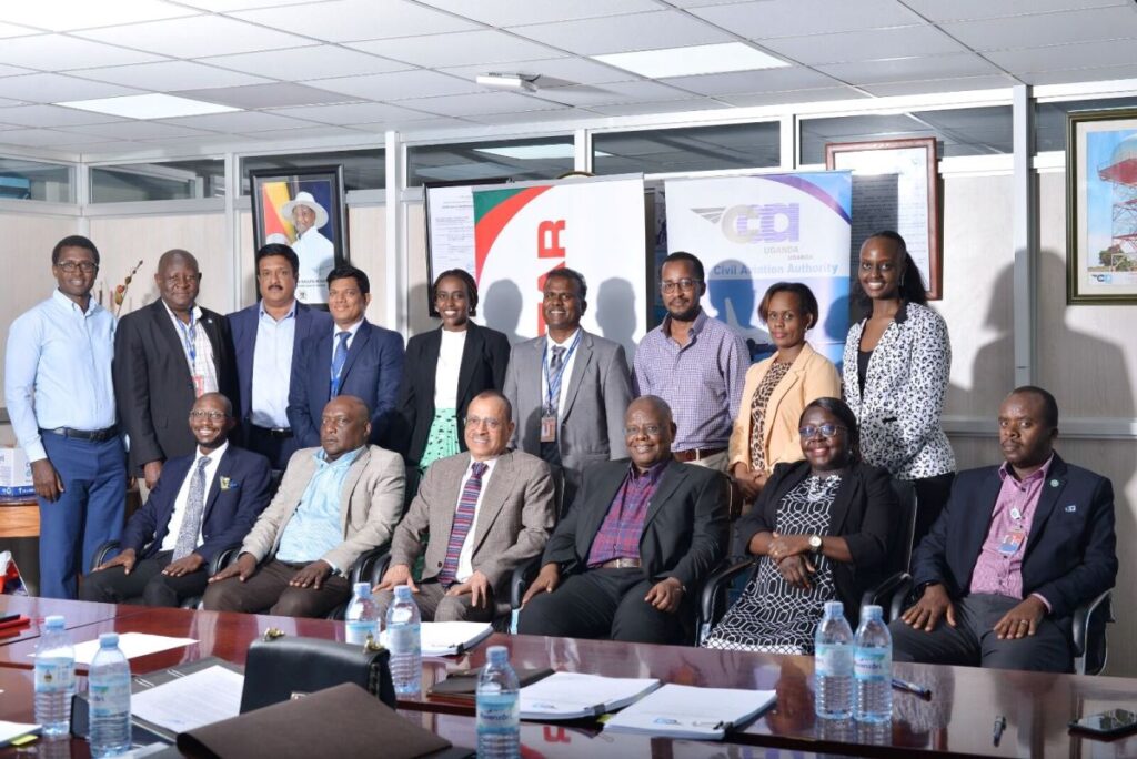 Group photograph of the Director General of UCAA, Mr. Fred Bamwesigye, the Group Chief Executive of Tristar, Mr. Eugene Mayne and the senior management staff and legal counsels from both sides