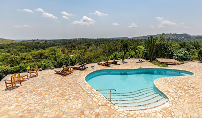 Outdoor swimming pool Photo Volcanoes Safaris Kyambura Gorge Lodge Queen Elizabeth National Park Uganda Western Region