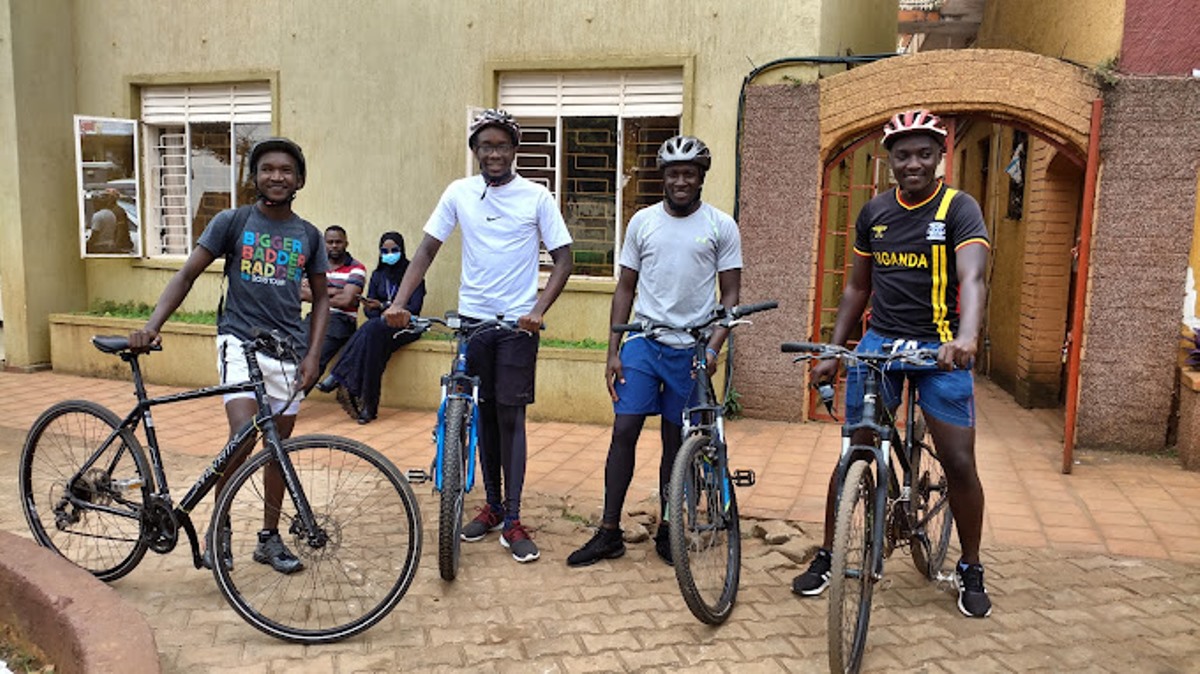 Photograph of four cyclists taken during a biking tour in Entebbe, Uganda