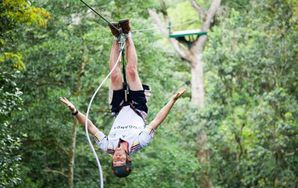 Photograph of a tourist taken during a zip lining tour to the Griffin Falls Camp in Mabira Forest in Lugazi, Uganda