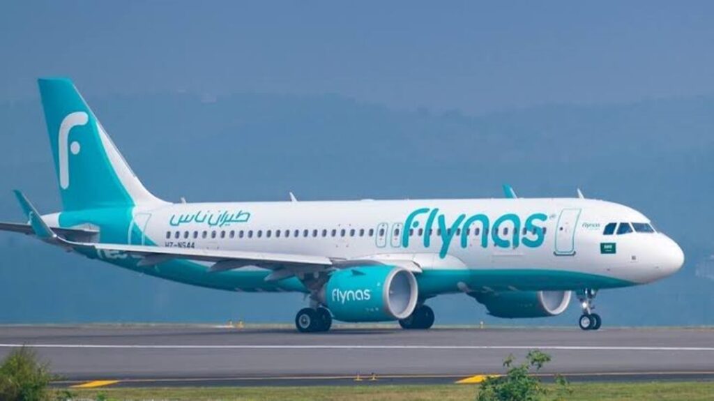 Photograph of one of the Flynas planes at the airport runway. On January 15, 2025, Flynas Uganda will mark a significant milestone with its inaugural flight from Riyadh to Entebbe. Photo Credit; ZuruLink Africa