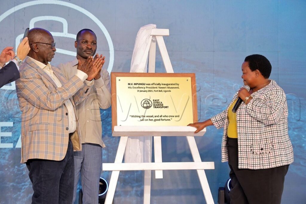 Hon Robinah Nabbanja (R), the Prime Minister alongside other government officials unveils a plaque during the launch of commercial operations of MV Mpungu at Port Bell in Kampala