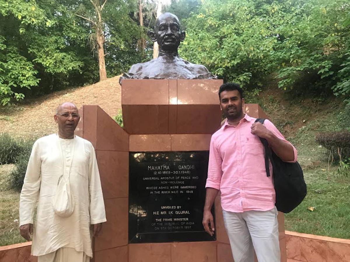 Photograph of tourists at the Mahatma Gandhi Monument taken during a Source of the Nile tour in Jinja, Uganda