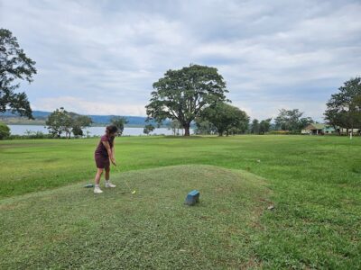 Photograph of a visitor playing golf at the Jinja Golf Club in Jinja, Uganda