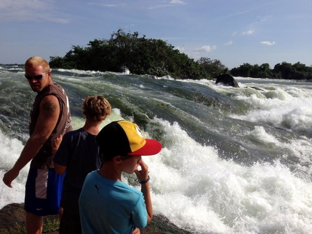 Photograph of tourists at the Itanda Falls taken during an Adventure tour to Jinja, Eastern Uganda