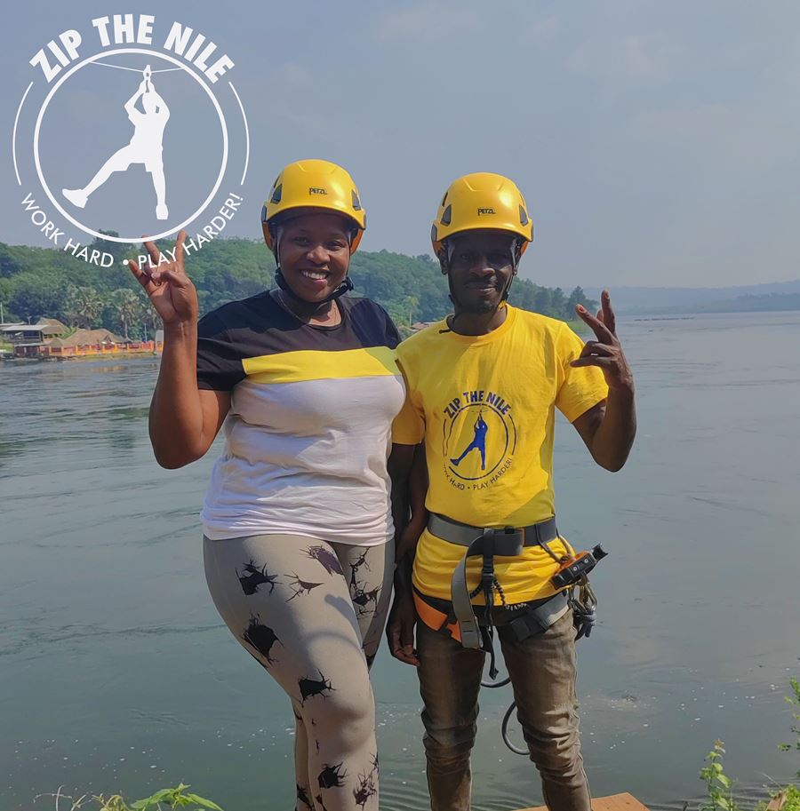 Photograph of a tourist and her guide taken during a ziplining tour over the Nile River in Jinja, Uganda