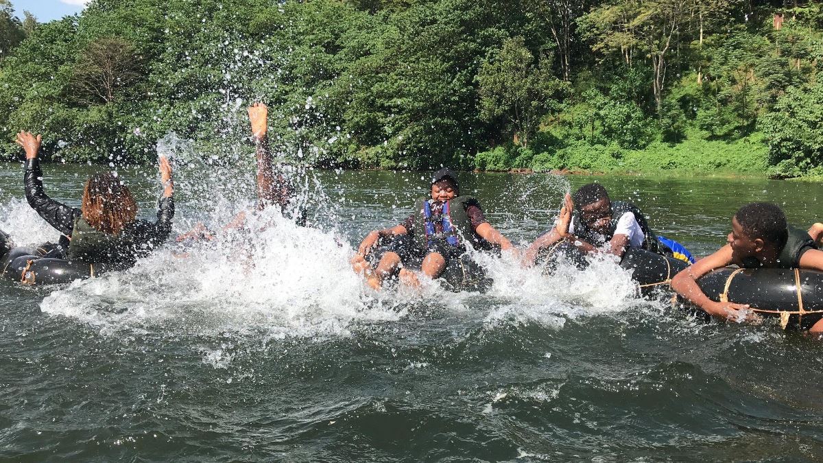 Photograph of tourists taken during a water tubing tour in Jinja, Eastern Uganda