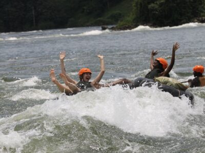 Photograph of tourists taken during a water tubing tour in Jinja, Eastern Uganda