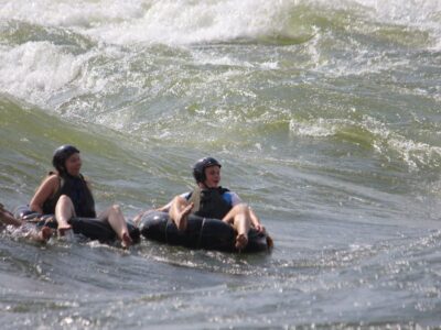 Photograph of tourists taken during a water tubing tour in Jinja, Eastern Uganda