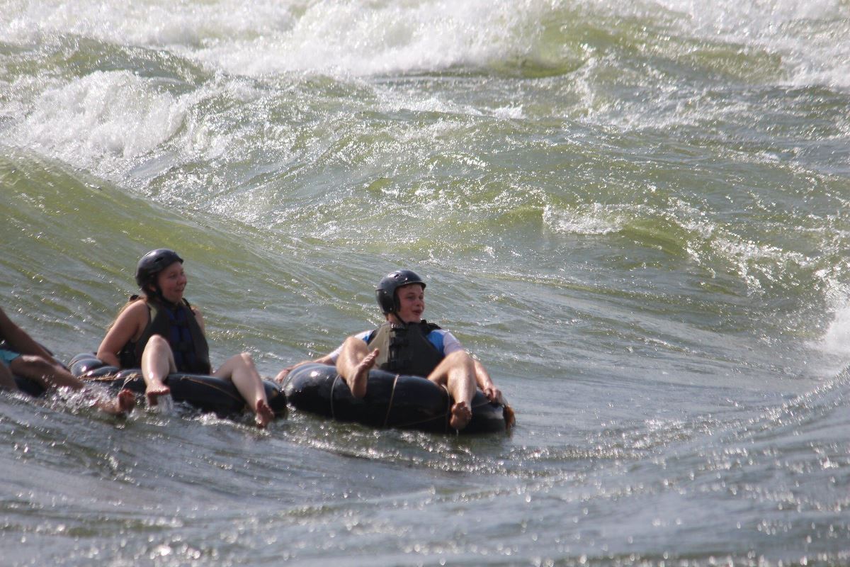 Photograph of tourists taken during a water tubing tour in Jinja, Eastern Uganda