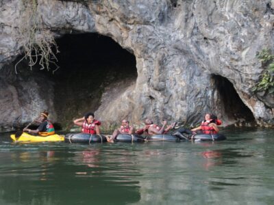 Photograph of tourists taken during a water tubing tour in Jinja, Eastern Uganda