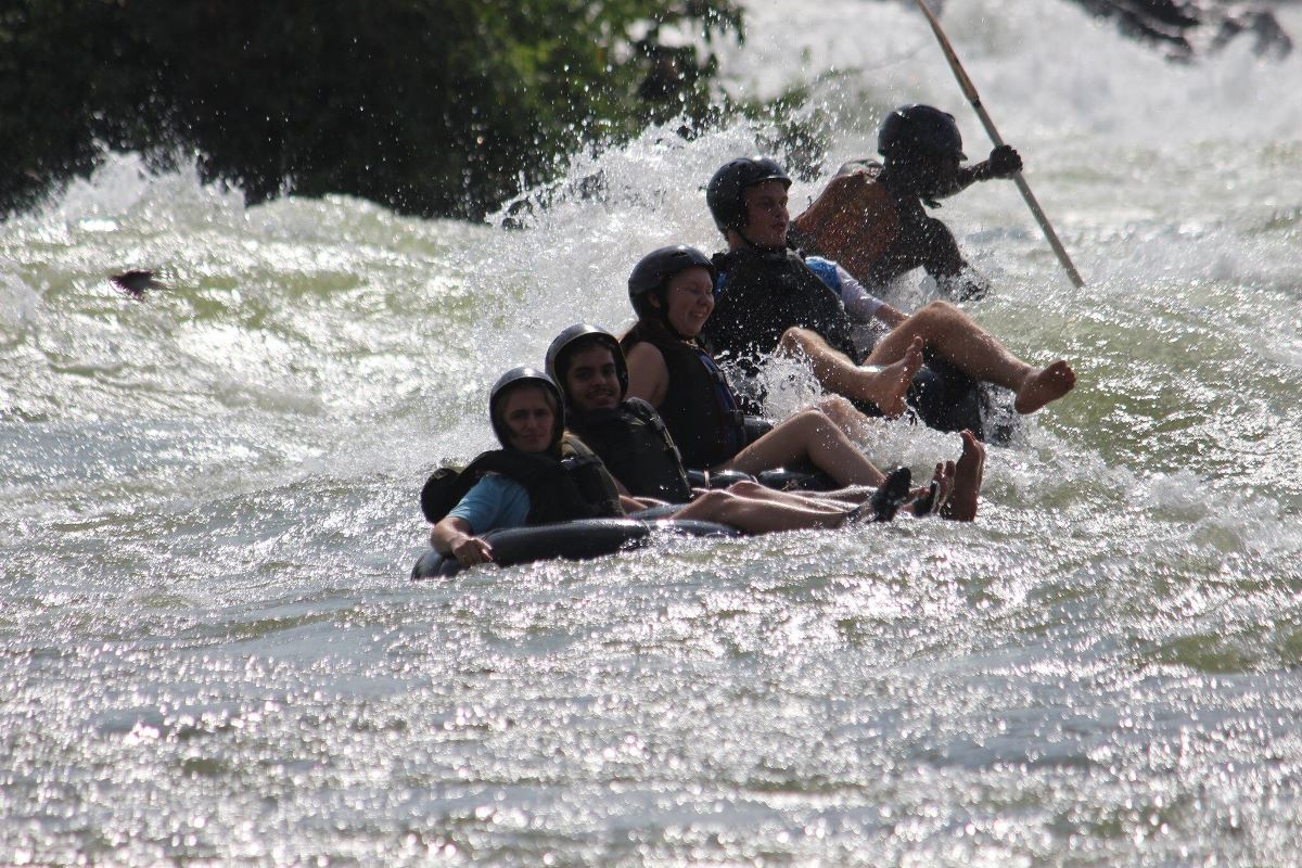 Photograph of tourists taken during a water tubing tour in Jinja, Eastern Uganda