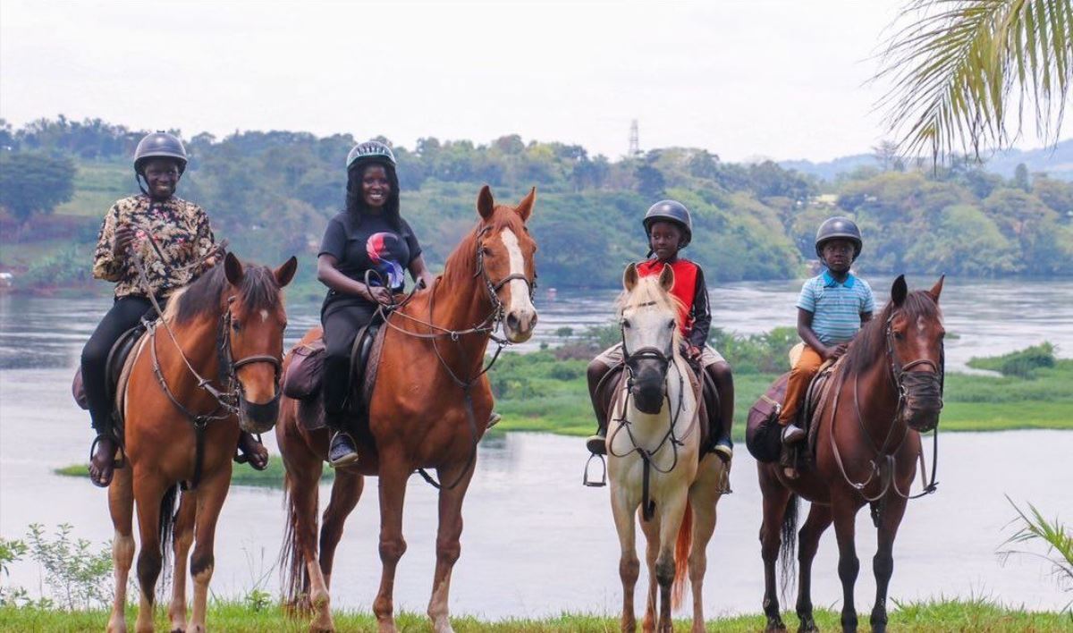 Photograph of a family taken during a horseback riding tour in Jinja, Eastern Uganda