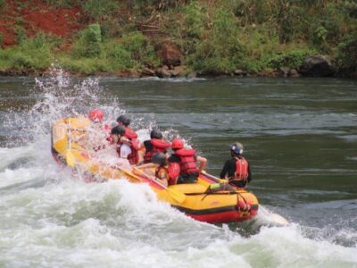 Photograph of tourists taken during a white water rafting tour on the Nile River in Jinja, Uganda