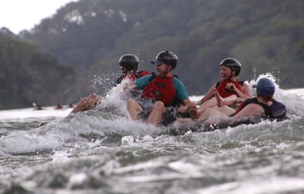 Photograph of tourists tubing on the the Itanda Falls waters in Jinja, Eastern Uganda