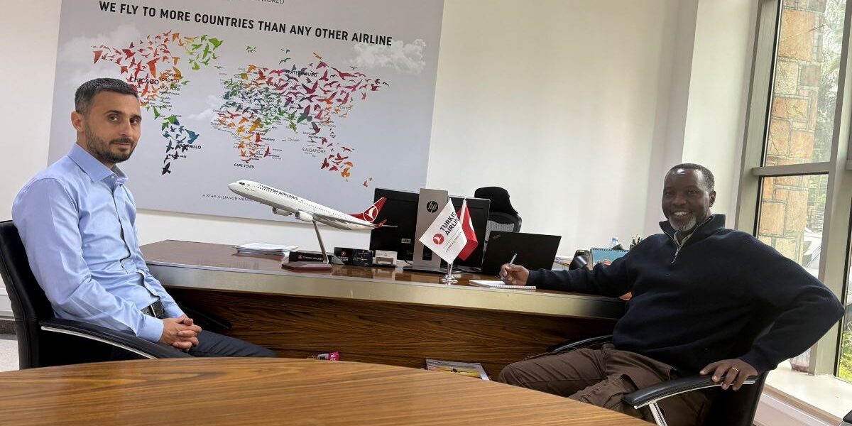 Photograph of Amos Wekesa, the founder of Great Lakes Safaris Limited and Ali Ozdemir, the country manager and sales representative at Turkish Airlines in Uganda