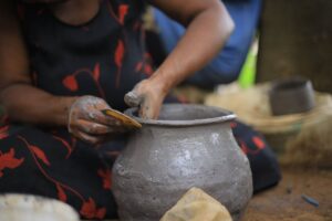 Photograph taken during a pottery session at the Nshenyi cultural village in Ntungamo, Western Uganda