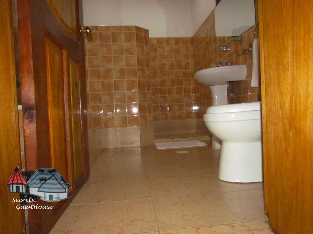 Bathroom Photo Secrets Guest House Entebbe Central Region