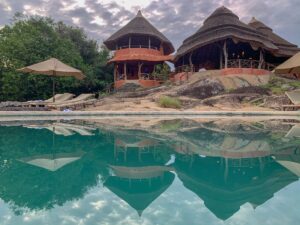 Photograph showing the property exterior and swimming pool of Mihingo Lodge in Lake Mburo National Park in Western Uganda