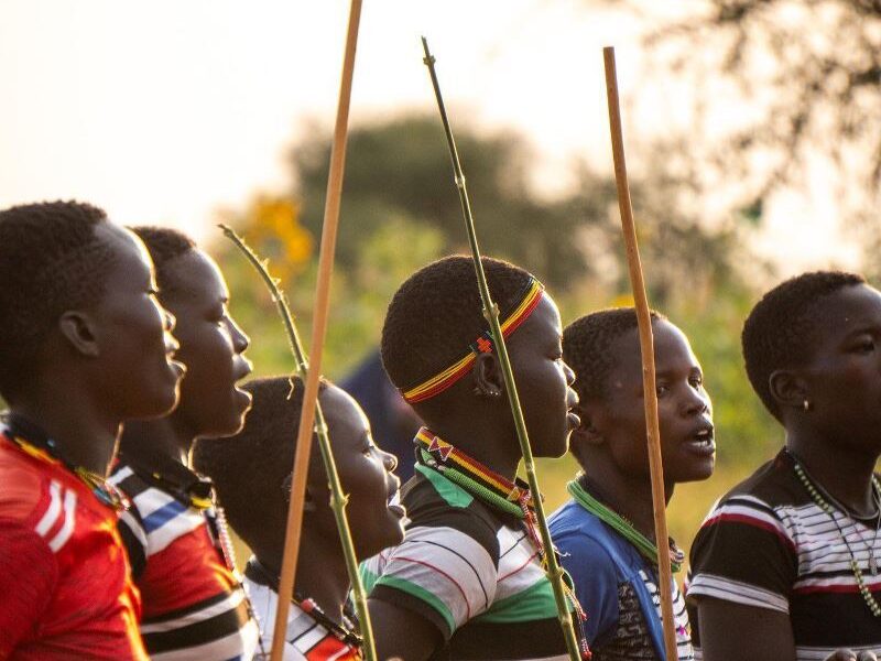 Photograph taken during a cultural dance presentation in the Karamojong region