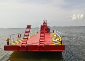 Photograph of the "The Barge," a custom-built flat-bottomed vessel designed to streamline logistics for its crown jewel, Paradise Island Resort