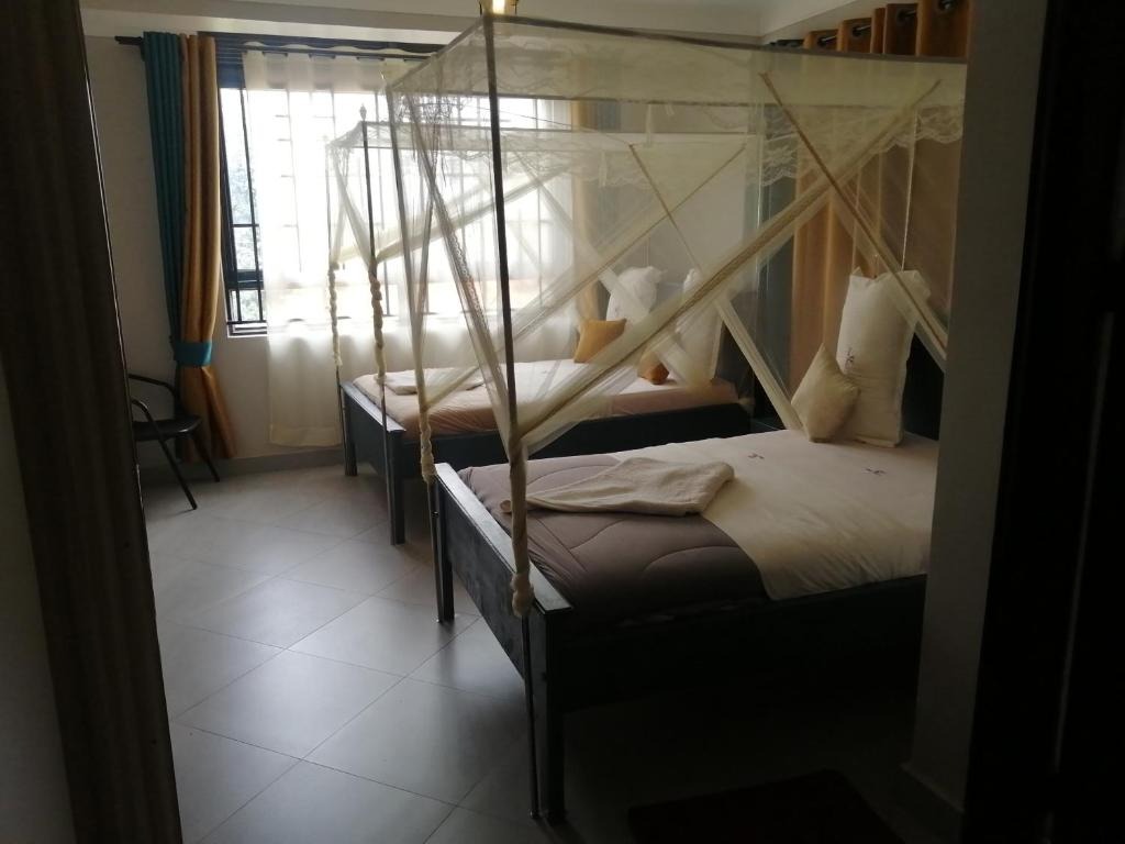Twin Bedroom Photo Petal Palace Motel Masindi Central Region