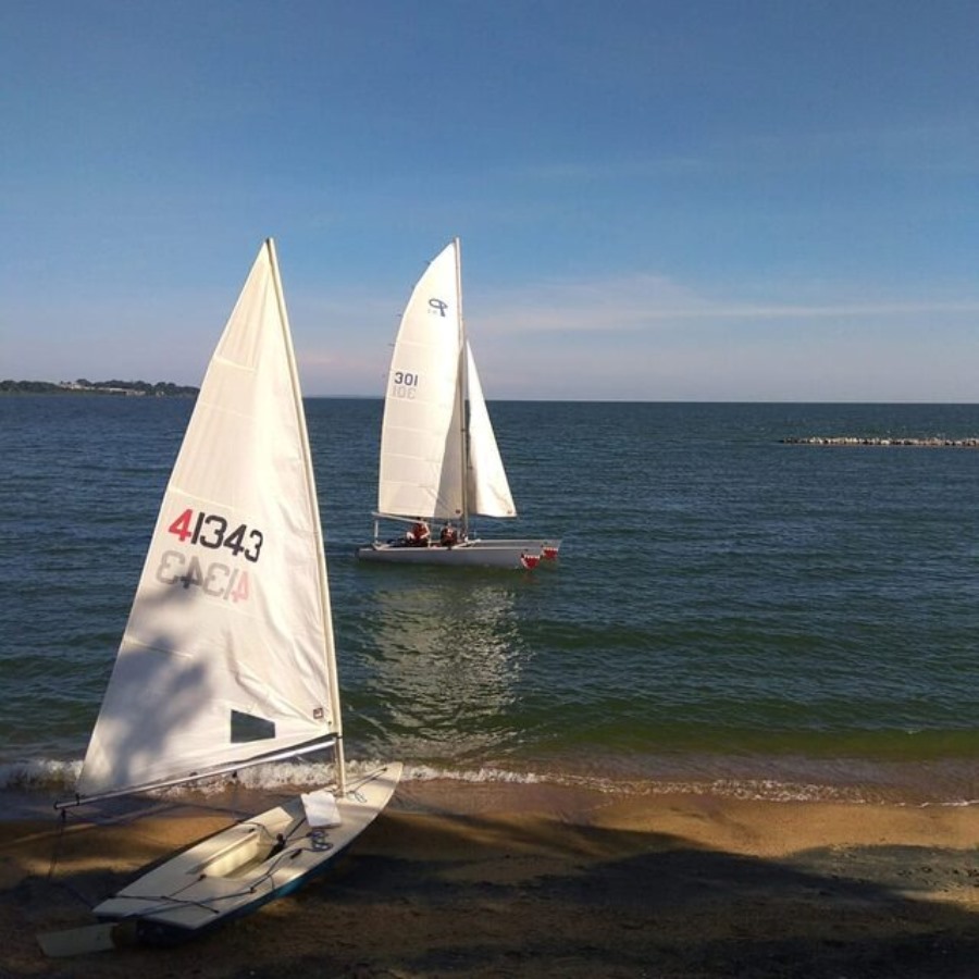 Photograph of a pair of sailboats taken from Entebbe Sailing Club in Entebbe, Uganda