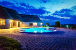 Photograph showing the exterior and swimming pool at Emburara Farm Lodge in Mbarara, Western Uganda