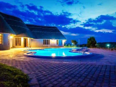 Photograph showing the exterior and swimming pool at Emburara Farm Lodge in Mbarara, Western Uganda