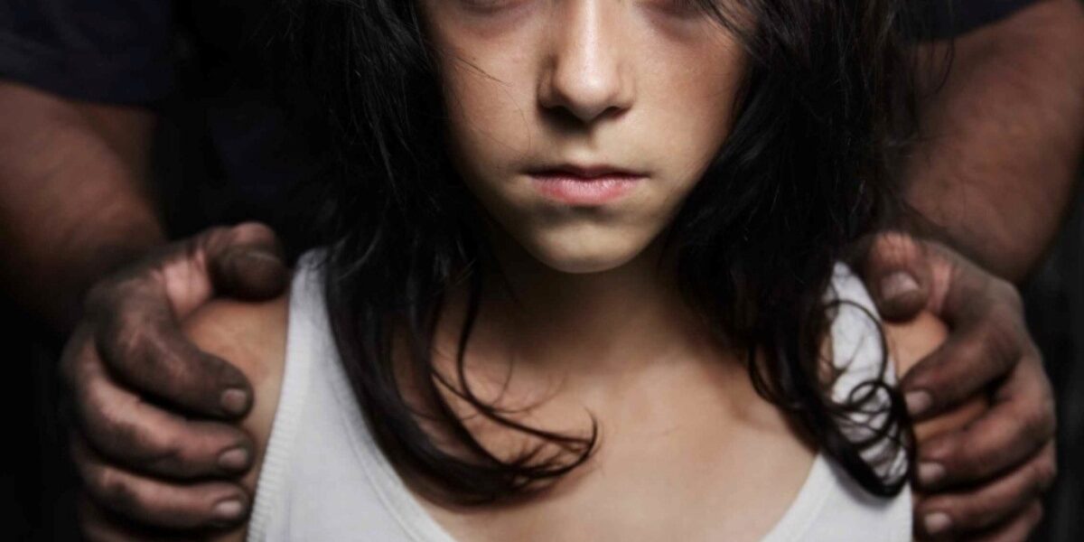 A poignant reminder of child sexual exploitation in travel and tourism: a vulnerable child restrained, symbolizing the urgent need to protect and empower the innocent from abuse