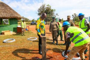 Photograph taken during Hon. Bahinduka Mugarra Martin's inspection of the installation works of an electric fence at Lokumoit Ranger Post in Kidepo Valley National Park