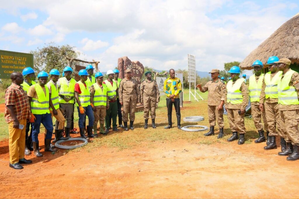 Photograph taken during Hon. Bahinduka Mugarra Martin's inspection of the installation works of an electric fence at Lokumoit Ranger Post in Kidepo Valley National Park