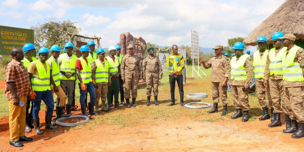 Photograph taken during Hon. Bahinduka Mugarra Martin's inspection of the installation works of an electric fence at Lokumoit Ranger Post in Kidepo Valley National Park