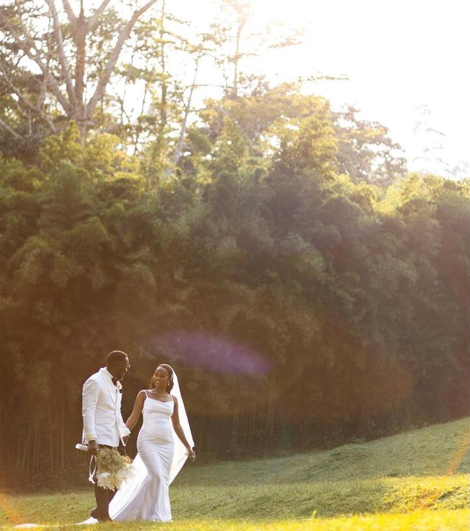 Young Uganda wedding couple in a Ssezibwa Falls garden with Ssezibwa Forest in the background. Photography by Ssezibwa Falls Resort