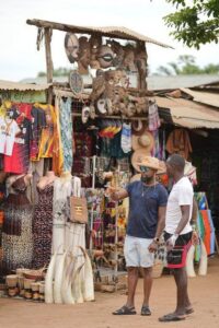 Photograph of two of the 30 Kenyan coastal stakeholders at a crafts shop taken during the 7-day familiarization trip in Uganda