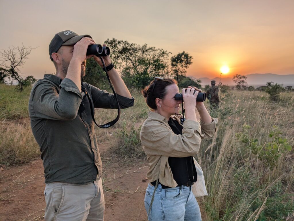 Evening Safari at Namoni Lodge – Guests explore the savanna of Kidepo Valley National Park, enjoying walking safaris and wildlife spotting near luxury tented accommodations.