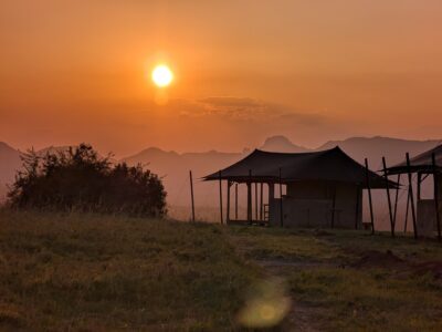 Sunrise at Namoni Lodge with tented accommodations overlooking the savanna in Kidepo Valley National Park, Uganda
