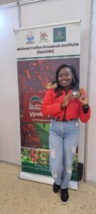 Photograph of a customer showing off their product taken during the East Africa Coffee Markets and Conference 2025