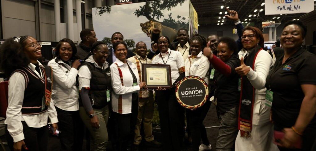 Photograph of the Ugandan team posing with the “Best in Show – Africa” award for its immersive and experiential showcase at the Travel & Adventure Show