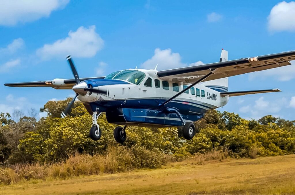 Asante Aviation's Cessna 208 Grand Caravan (5X-AMC) in action, delivering swift and scenic charter flights to remote destinations across East Africa