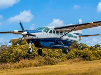 Asante Aviation's Cessna 208 Grand Caravan (5X-AMC) in action, delivering swift and scenic charter flights to remote destinations across East Africa
