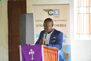 A representative of the Uganda Civil Aviation Authority speaks during a community engagement session on wildlife hazard management, highlighting the importance of local participation in safeguarding operations at Entebbe International Airport