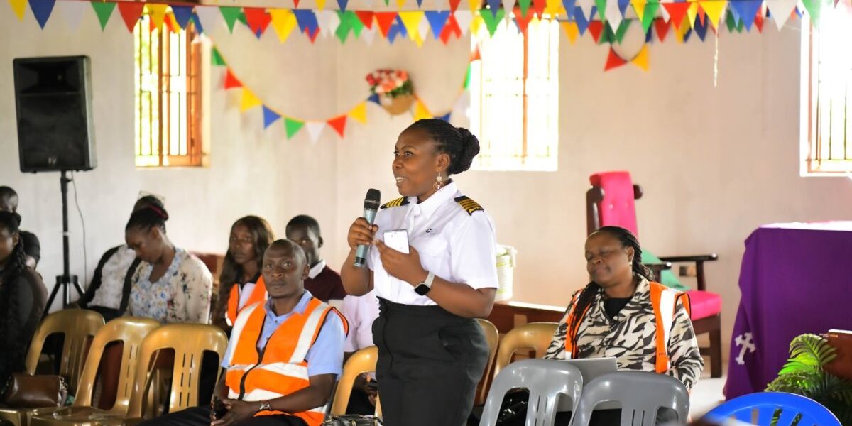 An official from the Uganda Civil Aviation Authority addresses members of the Buwaya fishing community during a wildlife hazard management sensitization meeting at St. Luke Church, Ssazi, aimed at improving aviation safety near Entebbe International Airport