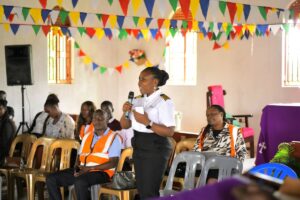 An official from the Uganda Civil Aviation Authority addresses members of the Buwaya fishing community during a wildlife hazard management sensitization meeting at St. Luke Church, Ssazi, aimed at improving aviation safety near Entebbe International Airport
