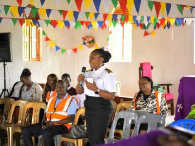 An official from the Uganda Civil Aviation Authority addresses members of the Buwaya fishing community during a wildlife hazard management sensitization meeting at St. Luke Church, Ssazi, aimed at improving aviation safety near Entebbe International Airport