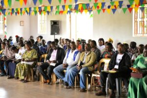 An attentive audience listens during the wildlife hazard management sensitization meeting for the Buwaya fishing community