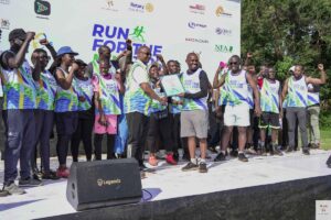 Participants celebrate at the Run For The Nile Marathon 2026 as organizers recognize efforts toward environmental conservation and community impact.