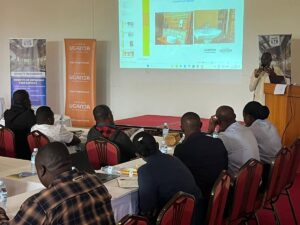 Uganda Tourism Board (UTB) trainer delivering a practical session on hospitality standards during a capacity-building workshop for hoteliers